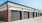 The garages at our apartments in McKinney, TX, featuring covered individual garages with black doors.