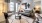 Model living room at our apartments in McKinney, featuring wood grain floor paneling and a door to the yard.